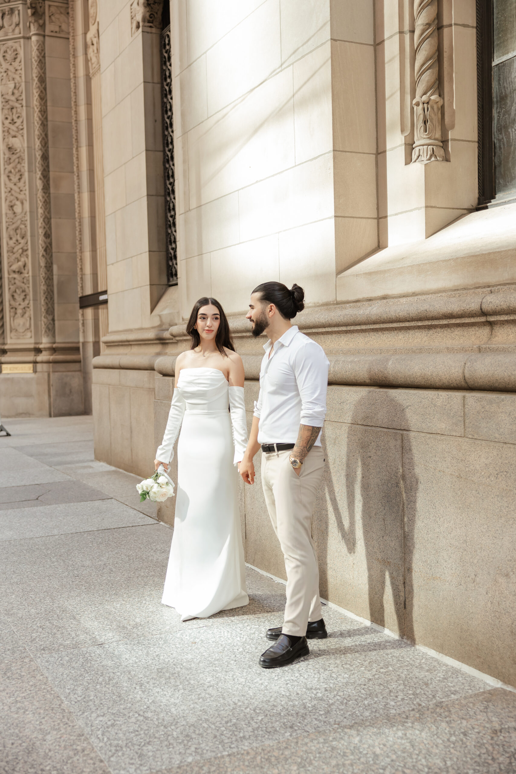 Candid downtown Toronto elopement photo of a couple walking in soft natural light, photographed by Spark Maple Media.